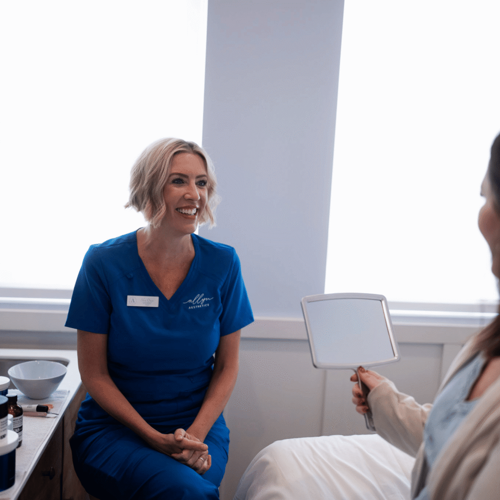 Licensed aesthetician performing a personalized skin assessment at Allyn Aesthetics in Mt. Juliet, TN